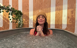 a girl in a cold plunge tank