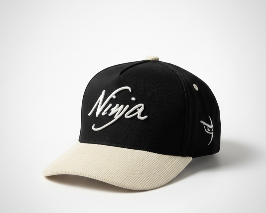 white and black embroidered snapback hat